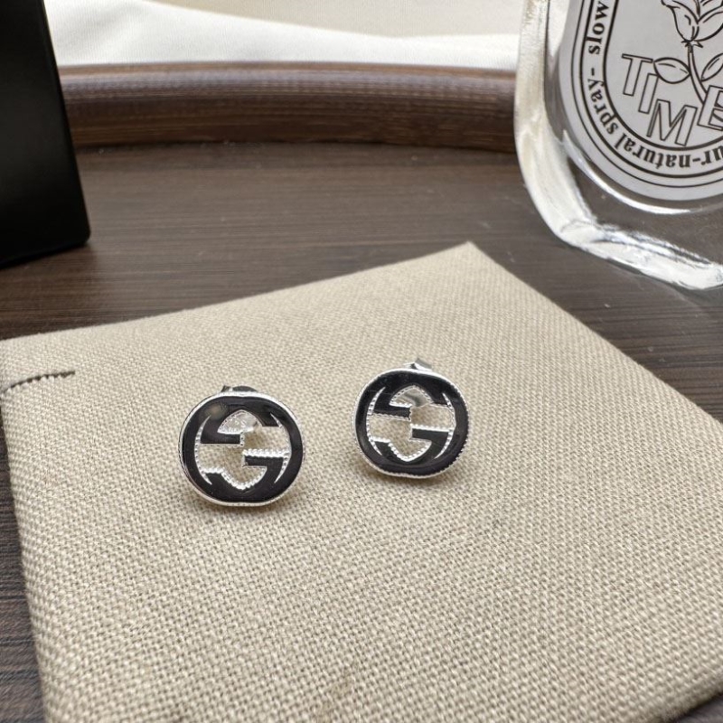 G*u*i earrings